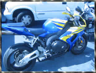 yellow and blue honda CBR